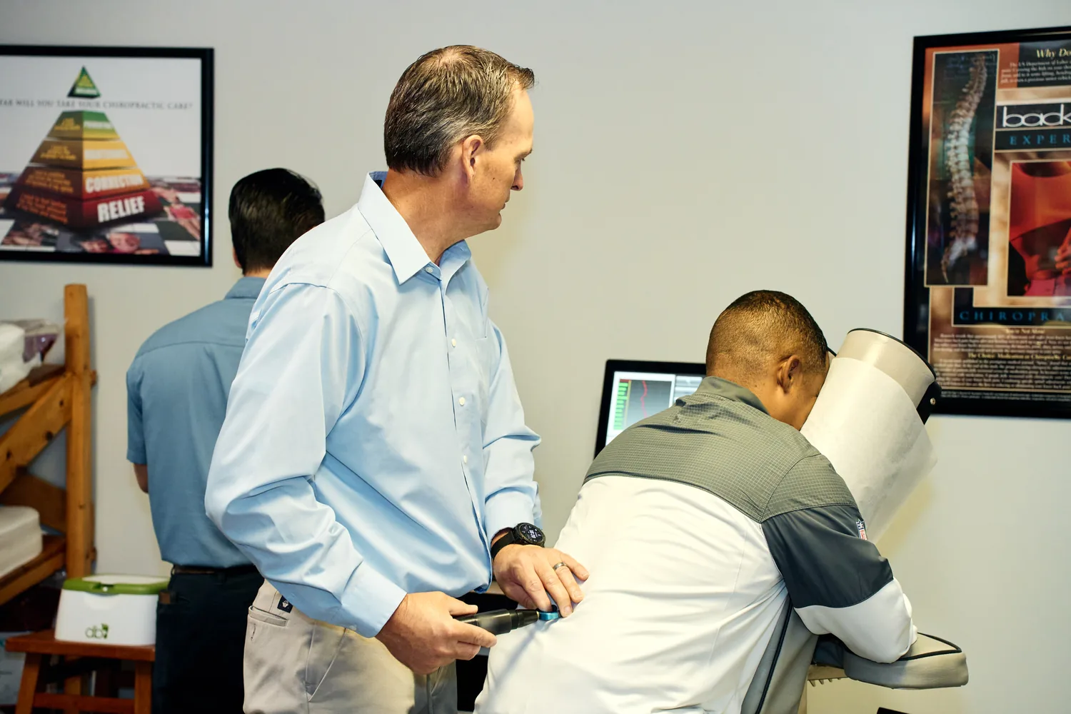 Dr. James Yager treating a patient with the computer-guided ProAdjuster at ProHealth Chiropractic in Garden City, Kansas